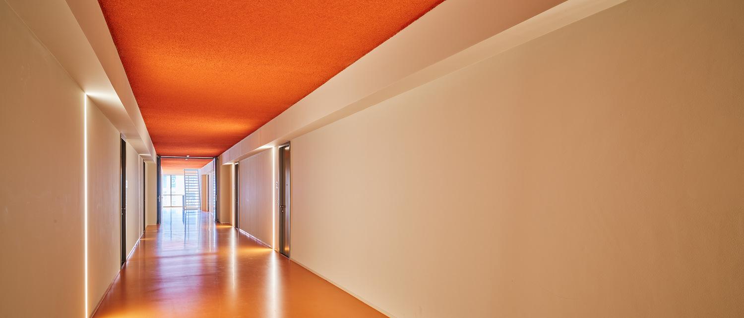 Hallway treated with Acosorb acoustic spray ceiling solution